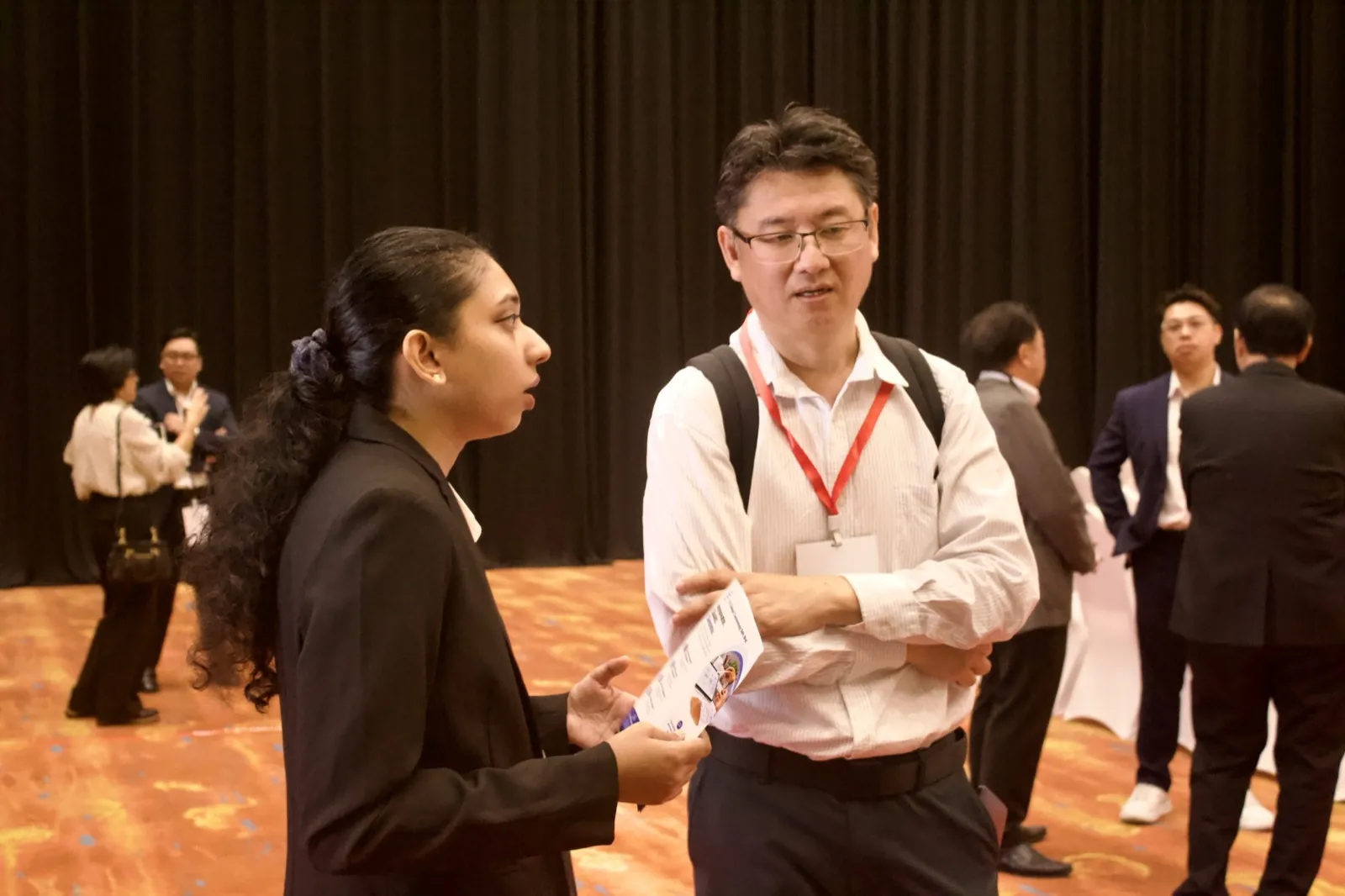 Networking conversation in the forum hall