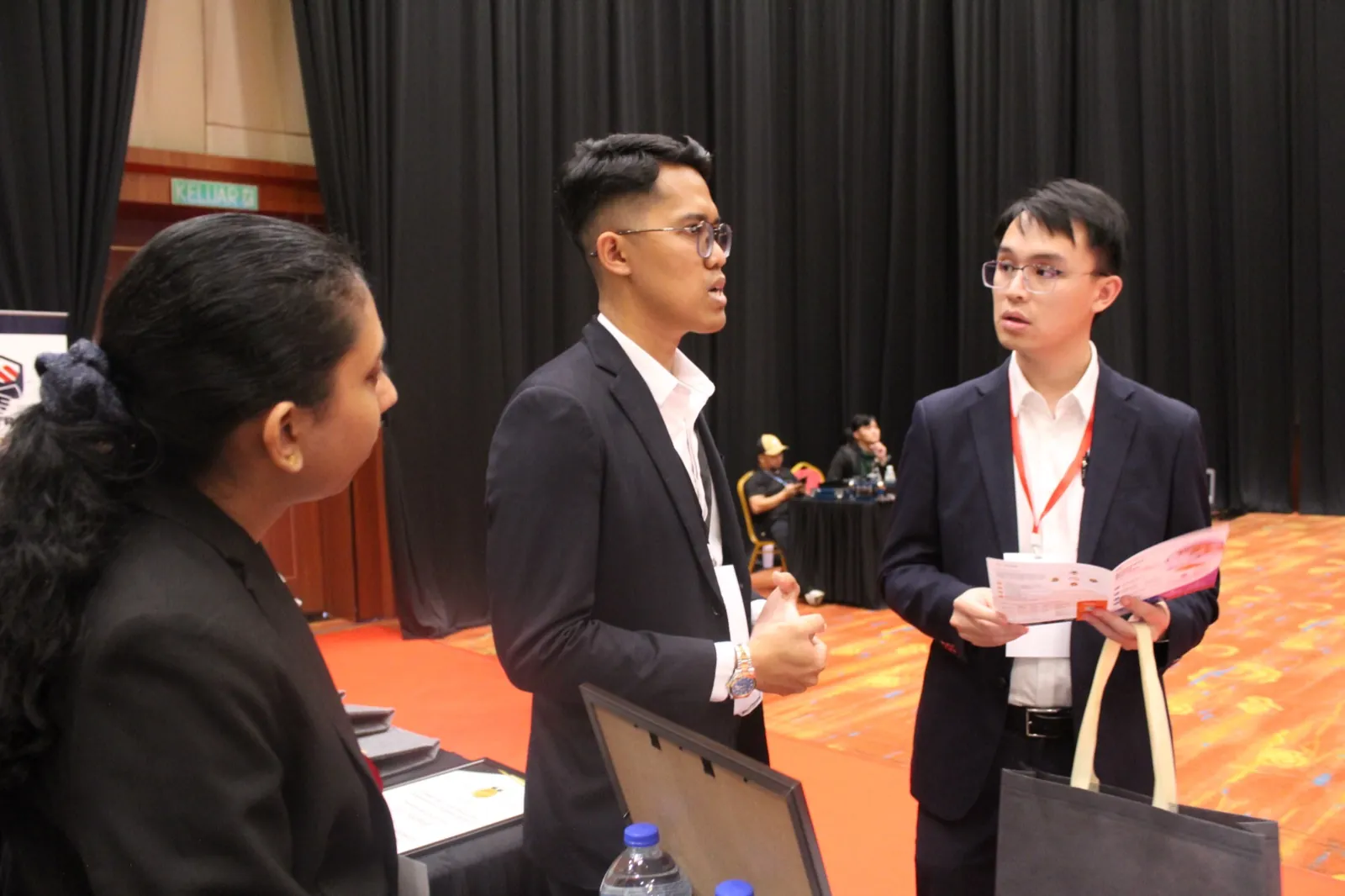 OC Global Technology team speaking with delegates at MDEF2026